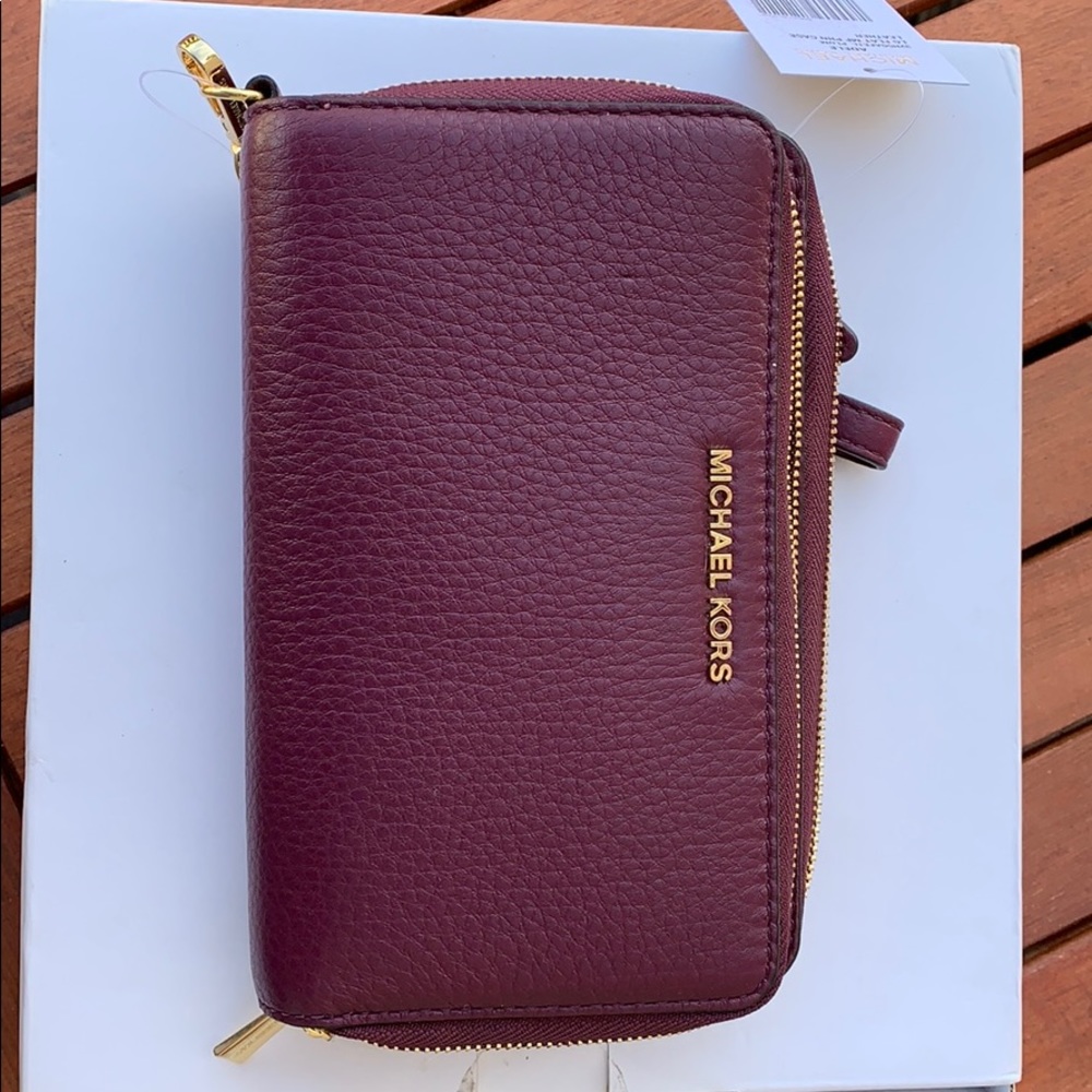 NWT Michael Kors plum leather phn case wallet
